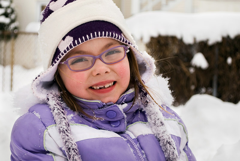 Child in winter with glasses